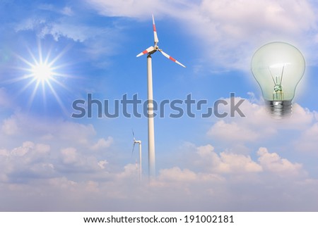 The sun, wind turbines as a source of energy to a light bulb.