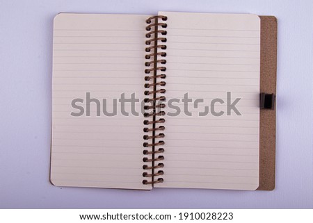 yellow leaf lined small notebook that can be carried in a pocket that is often used in daily life