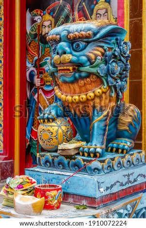 Male Shishi guardian lion at Chinese Buddhist temple Klenteng Caow Eng Bio. Tajung Benoa, Badung, Bali, Indonesia.