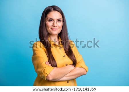 Photo portrait of smart business woman with crossed hands isolated on vibrant blue color background copyspace
