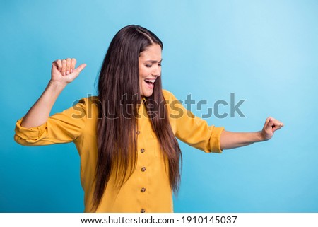 Photo portrait of brunette with long hair happy dancing at party laughing isolated on bright blue color background