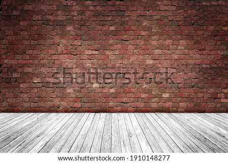 Empty Interior room with old red brick wall, wooden plank floor, used as studio background wall to display your products. Space for text and picture. Design ideas and style.