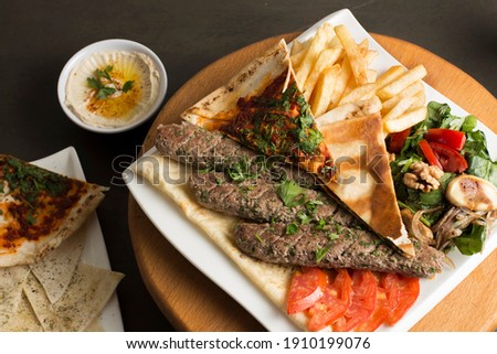 Kabab is an Arabian meal photographed on black dark background... It's a healthy meal 