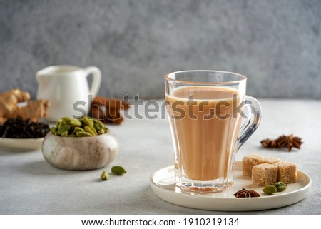 Traditional middle eastern , indian drink masala or karak chai. Closeup Royalty-Free Stock Photo #1910219134