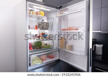 Open Refrigerator Filled With Fresh Fruits And Vegetable Royalty-Free Stock Photo #1910245906