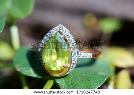 Jewelry ring with chrysolite close-up.
