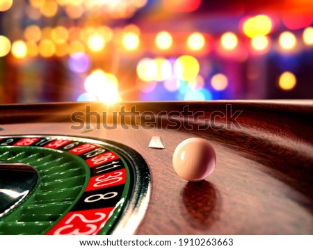 Inside of a spinning Roulette wheel close up at the Casino - Selective Focus Royalty-Free Stock Photo #1910263663