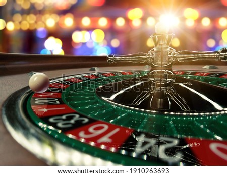 Inside of a spinning Roulette wheel close up at the Casino - Selective Focus Royalty-Free Stock Photo #1910263693