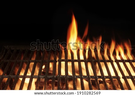 Flaming BBQ Charcoal Grill Background. Hot Barbeque Grill Ready Cooking Food On Cast Iron Grate. Concept For Cookout, Barbecue Party At Garden Or Backyard. Grill With Bright Flames Black Isolated.