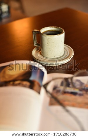 Hot Black coffee while reading a book. in vintage style