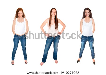 Full length portraits of three happy young women wearing blue jeans and white tops, isolated on white studio background
