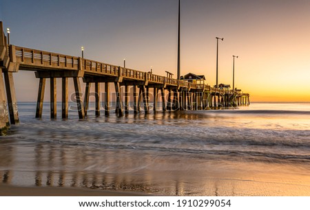 Jennette's Fishing Pier in Nags Head North Carolina at sunrise. Royalty-Free Stock Photo #1910299054