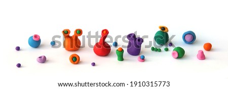 Handmade clay plasticine figurines isolated on white background. Colorful slugs from play dough. 
