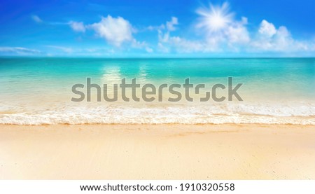 Beautiful background image of tropical beach. Bright summer sun over ocean. Blue sky with light clouds, turquoise ocean with surf and clear sand. Harmony of clean environment. Wide format.