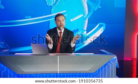 Live News Studio with Handsome Male Newscaster Reporting on the Events of the Day. TV Broadcasting Channel with Charismatic Presenter, Anchor Talking. Mock-up Television Channel Newsroom Set