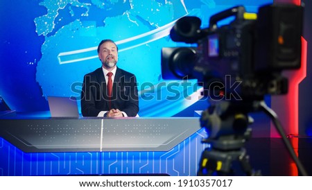 Live News Studio with Professional Male Newscaster Reporting on the Events of the Day. TV Broadcasting Channel with Presenter, Anchor Talking. Mock-up Television Channel Newsroom Set.