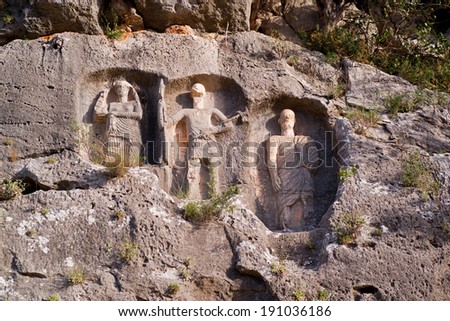 on the rock of the tomb reliefs