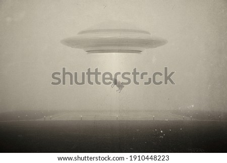 UFO kidnaps a cow . Photo with 3d rendering element and vintage film camera effects Royalty-Free Stock Photo #1910448223