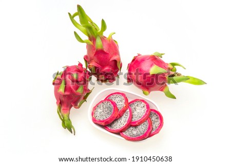  Closeup top view of three  Dragon fruits, Pitaya, fruit of cactus species   with slices displayed isolated against white background  ,