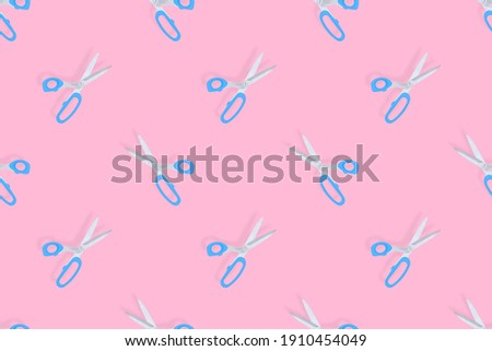 Scissors seamless pattern. Barber scissors on a pink background. 