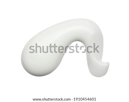 Close up of white cosmetic body lotion sample isolated on white background. Top view Royalty-Free Stock Photo #1910454601
