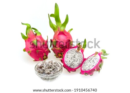  Closeup top view of two Dragon fruits, Pitaya, fruit of cactus species   with slices and cubes  displayed isolated against white background 
