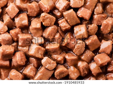 Wet pet food background. The view from top Royalty-Free Stock Photo #1910485933