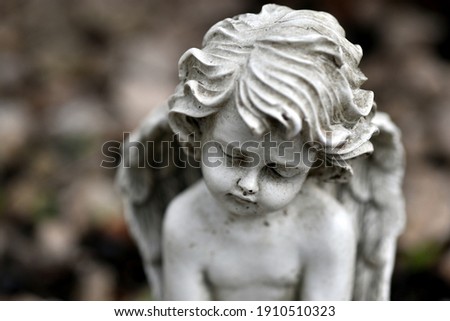 Portrait of a sad stone angel
 Royalty-Free Stock Photo #1910510323