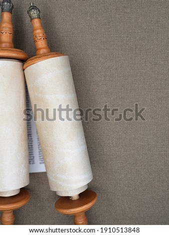 Torah scrolls written on parchment against a linen canvas background
copy space Royalty-Free Stock Photo #1910513848