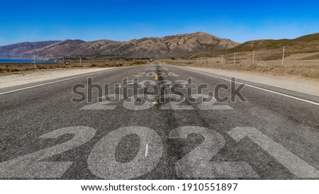 2021-2026 written on highway road to the mountain Royalty-Free Stock Photo #1910551897