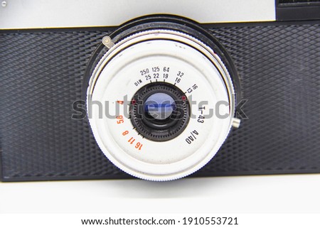 Vintage old photo camera on the white background