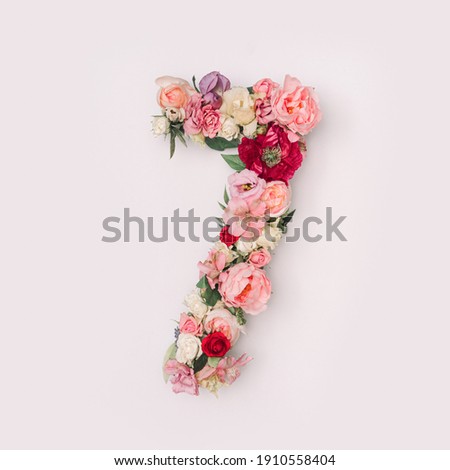 Number 7 made of real natural flowers and leaves. Flower font concept. Unique collection of letters and numbers. Spring, summer and valentines creative idea.