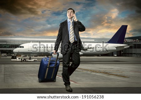 Businessman with baggage in airport