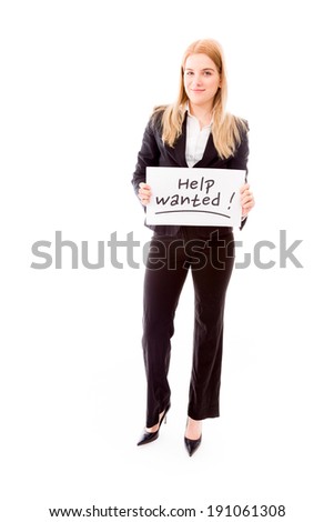 Businesswoman holding a message board with the text words "Help wanted"