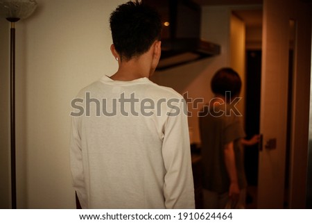 Image of a woman leaving the room  Royalty-Free Stock Photo #1910624464