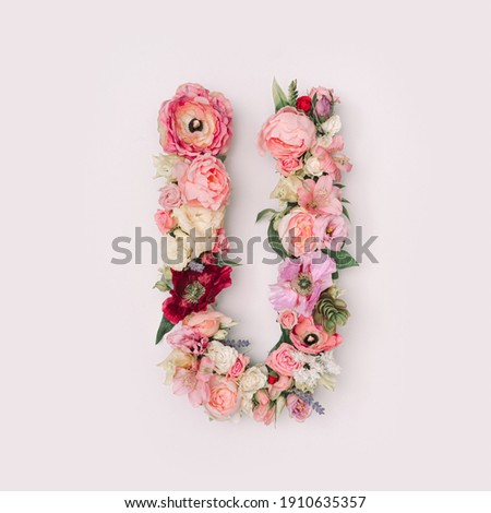 Letter U made of real natural flowers and leaves. Flower font concept. Unique collection of letters and numbers. Spring, summer and valentines creative idea. Royalty-Free Stock Photo #1910635357