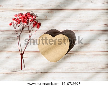 Heart and red gypsophila on the whiteboard background