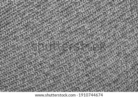 Grey knitted sweater texture as a background