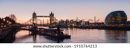 London - Panorama view along the river Thames showing Tower Bridge and City Hall with Tower Millennium Pier in the foreground