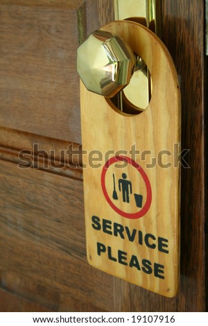 label on a door with writing "service please"