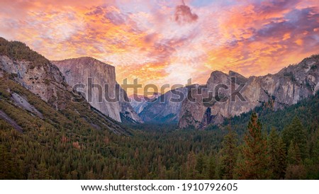 Yosemite valley nation park during sunset view from tunnel view on twilight time. Yosemite nation park, California, USA. Panoramic image. Royalty-Free Stock Photo #1910792605