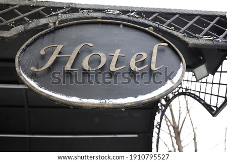 View of metal signboard hotel in winter