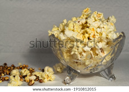 A bowl of salted popcorn on the table