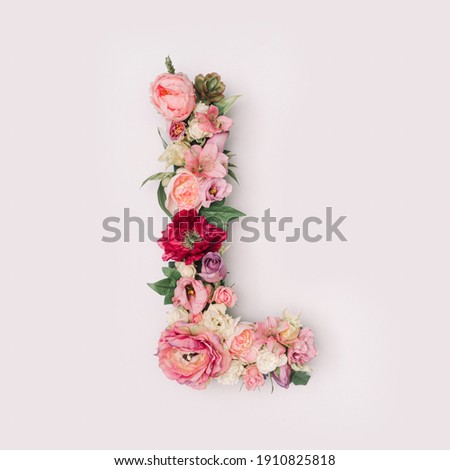 Letter L made of real natural flowers and leaves. Flower font concept. Unique collection of letters and numbers. Spring, summer and valentines creative idea. Royalty-Free Stock Photo #1910825818