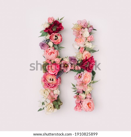 Letter H made of real natural flowers and leaves. Flower font concept. Unique collection of letters and numbers. Spring, summer and valentines creative idea.