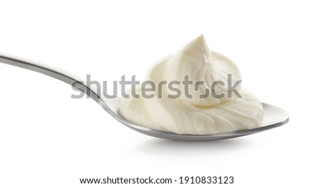 spoon of whipped mascarpone cheese cream isolated on white background