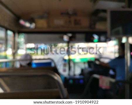 Blur focus of people on the bus in Thailand.Blur focus of Passengers on a bus traveling around Bangkok in Thailand.