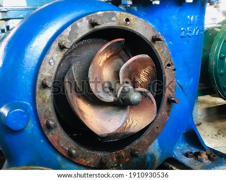 Maintenance of impeller fan in water pump. Royalty-Free Stock Photo #1910930536