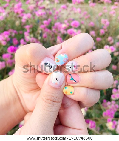 The cute cartoon nail designed. The easy toy and joy on the hands.