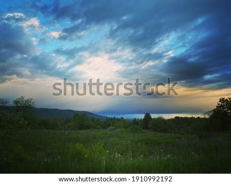 Summer evening looking over a field in Vermont 